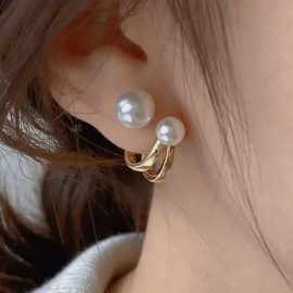 A pair of pearl earrings that can be worn in two ways